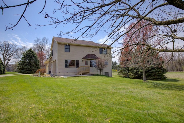 1414 Plains Rd, Leslie, MI 49251 - back of house featuring a yard