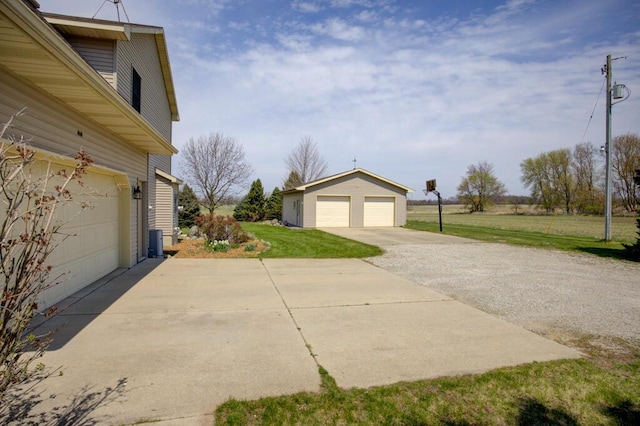 1414 Plains Rd, Leslie, MI 49251 - view of side of property with an outbuilding and a lawn