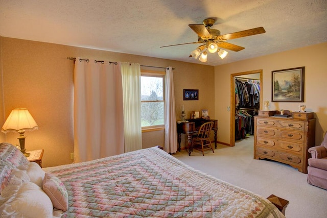 1414 Plains Rd, Leslie, MI 49251 - bedroom featuring a walk in closet, a textured ceiling, a closet, and carpet
