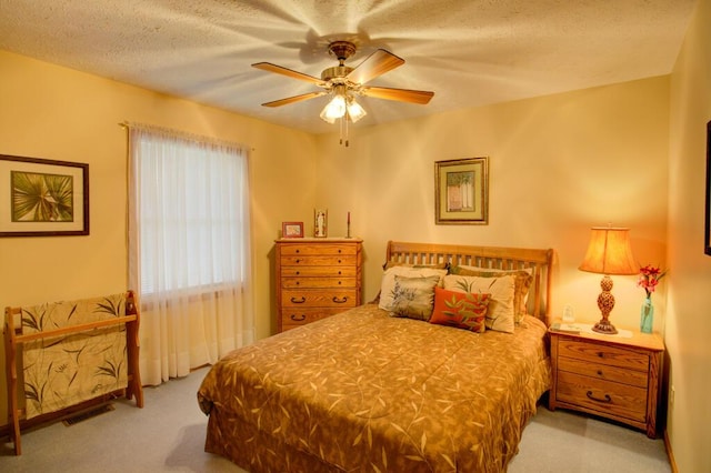1414 Plains Rd, Leslie, MI 49251 - bedroom with a textured ceiling, visible vents, ceiling fan, and carpet floors