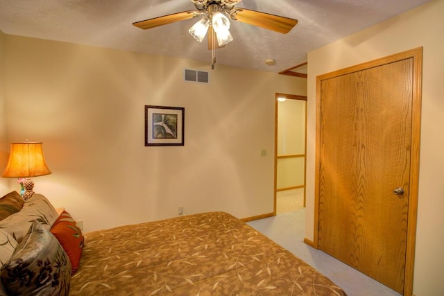 1414 Plains Rd, Leslie, MI 49251 - bedroom featuring carpet flooring, ceiling fan, visible vents, baseboards, and a textured ceiling