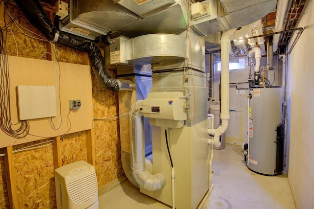 1414 Plains Rd, Leslie, MI 49251 - utility room featuring gas water heater
