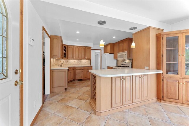 kitchen with glass insert cabinets, white appliances, a peninsula, backsplash, and light countertops