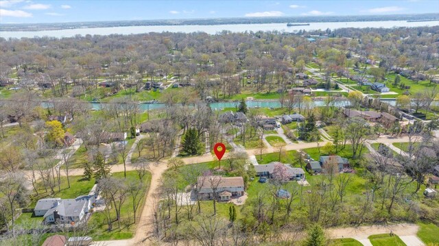 drone / aerial view featuring a water view and a residential view
