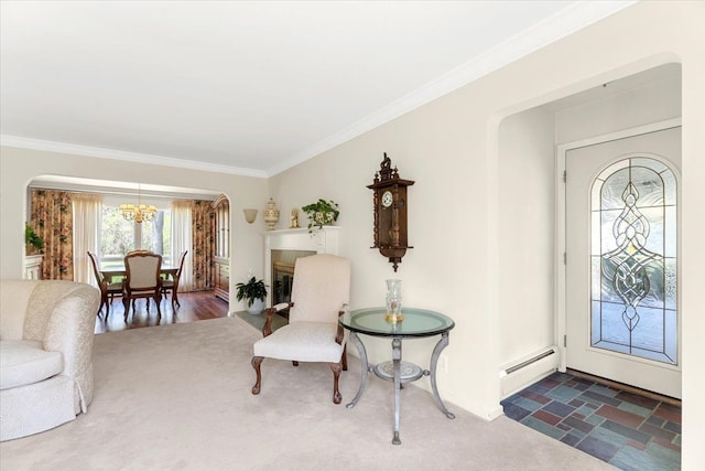 entryway featuring ornamental molding, a notable chandelier, a baseboard radiator, and arched walkways