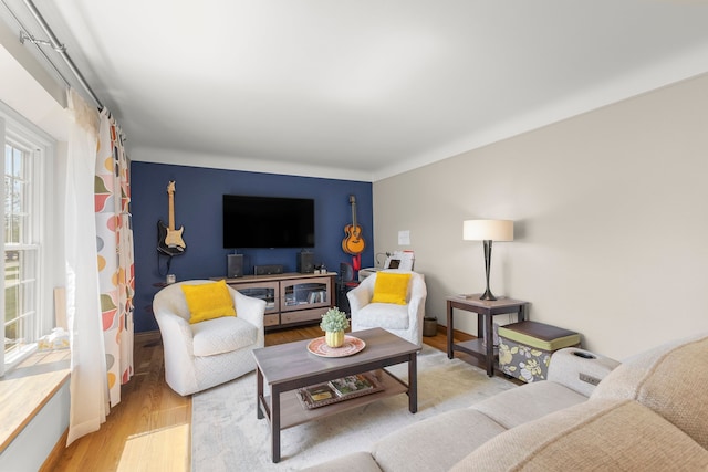 living room featuring baseboards and wood finished floors