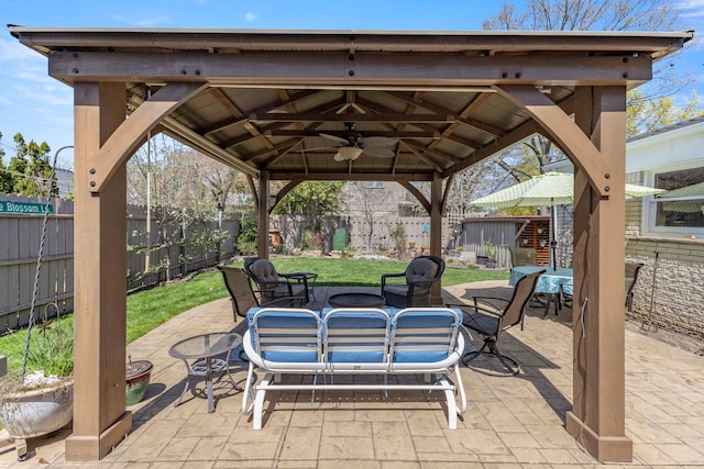 view of patio / terrace with a gazebo and a fenced backyard
