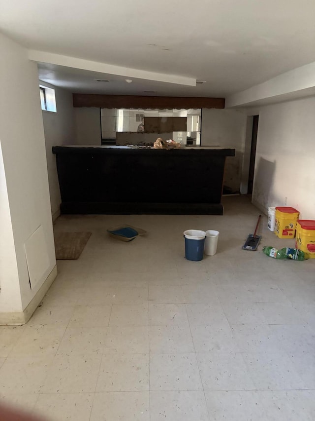 below grade area with light floors and baseboards