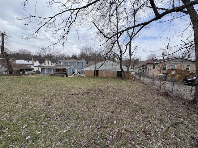 view of yard with a deck and fence