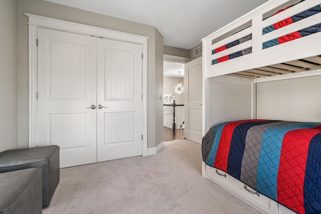1300 N Eagle Lake Dr, Kalamazoo, MI 49009 - bedroom with carpet, visible vents, and a closet