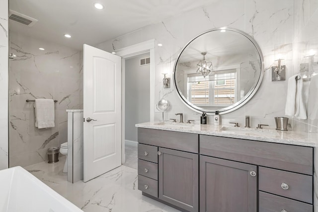 1300 N Eagle Lake Dr, Kalamazoo, MI 49009 - full bathroom featuring visible vents, recessed lighting, marble finish floor, and a sink