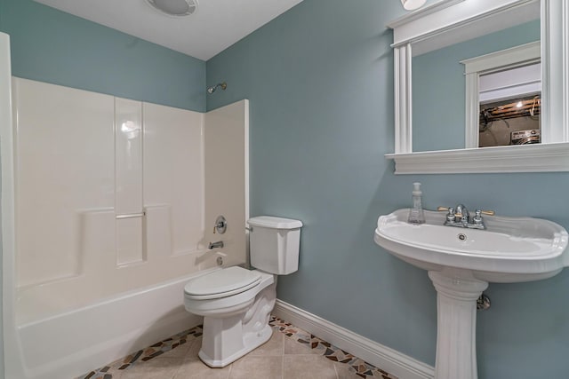 1300 N Eagle Lake Dr, Kalamazoo, MI 49009 - bathroom with tile patterned floors, baseboards, toilet, and bathtub / shower combination