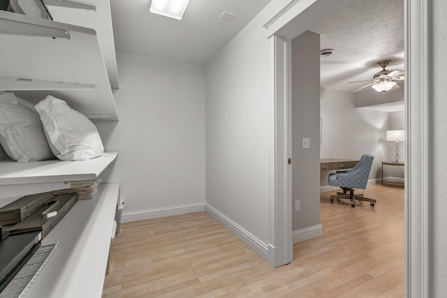 1300 N Eagle Lake Dr, Kalamazoo, MI 49009 - walk in closet featuring a ceiling fan and light wood-type flooring