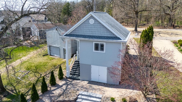 1300 N Eagle Lake Dr, Kalamazoo, MI 49009 - exterior space featuring stairway and a shingled roof