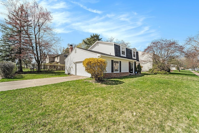 view of front of home featuring driveway, a front yard, a gambrel roof, and a garage