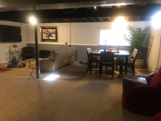 1130 Andover Cir, Commerce Twp, MI 48390 - living area featuring wainscoting and concrete floors