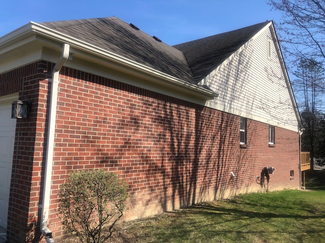 1130 Andover Cir, Commerce Twp, MI 48390 - view of property exterior with brick siding, a shingled roof, and a garage