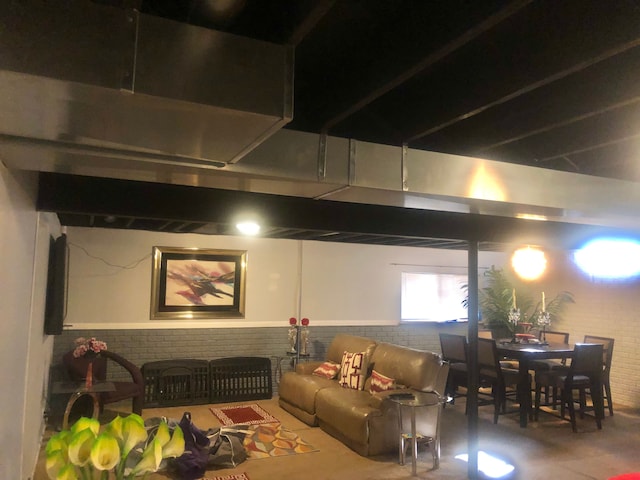 1130 Andover Cir, Commerce Twp, MI 48390 - living room with finished concrete floors and wainscoting