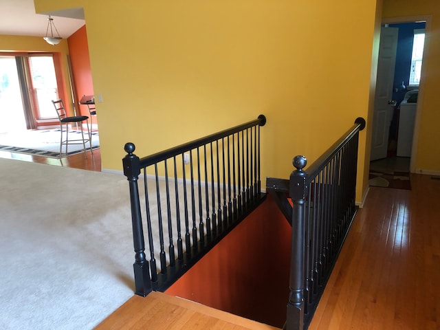 1130 Andover Cir, Commerce Twp, MI 48390 - stairway with healthy amount of natural light, baseboards, and hardwood / wood-style floors