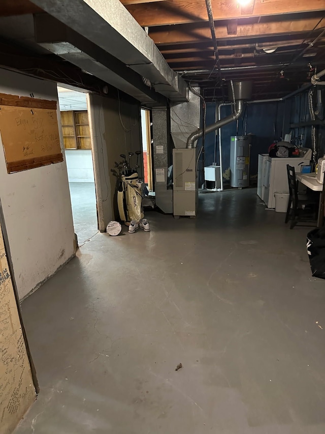 508 Lexington Ave, East Lansing, MI 48823 - unfinished basement featuring washer / dryer, water heater, and heating unit