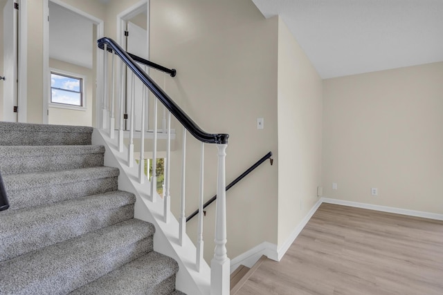 9315 Kingsley Dr, Onsted, MI 49265 - stairway with wood finished floors and baseboards