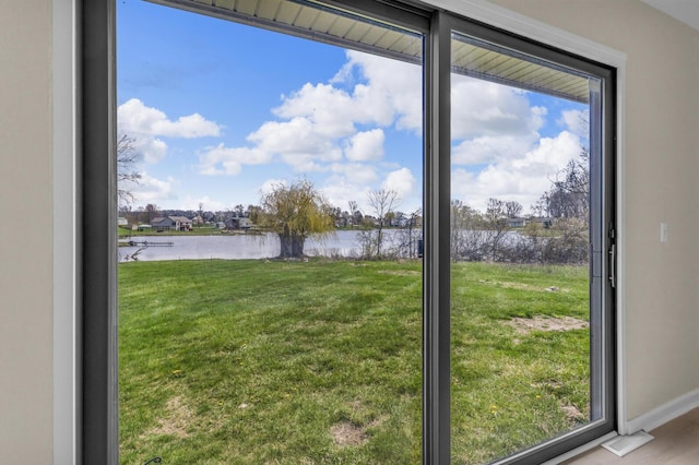 9315 Kingsley Dr, Onsted, MI 49265 - doorway to outside featuring a water view and baseboards