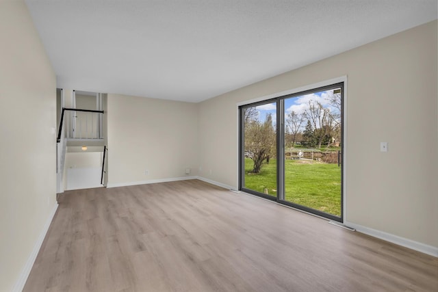 9315 Kingsley Dr, Onsted, MI 49265 - unfurnished living room with baseboards, visible vents, and wood finished floors