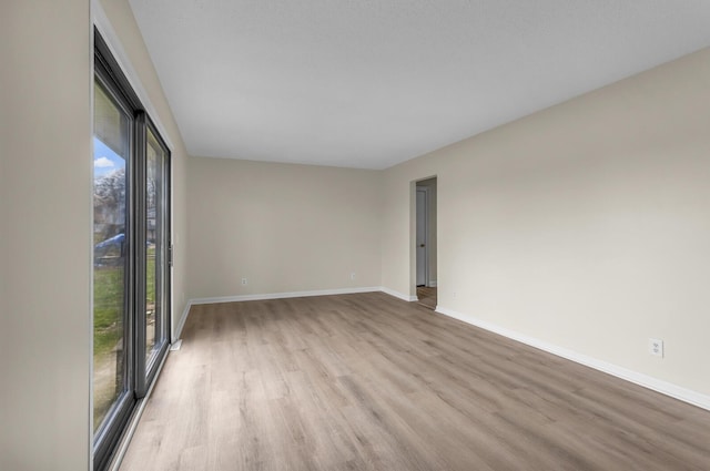 9315 Kingsley Dr, Onsted, MI 49265 - unfurnished room with light wood finished floors and baseboards