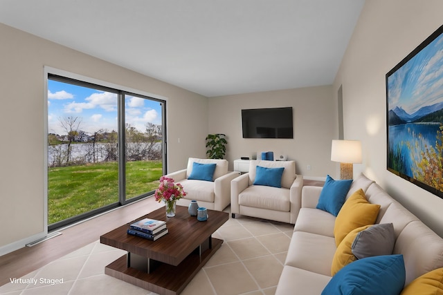 9315 Kingsley Dr, Onsted, MI 49265 - living room featuring a healthy amount of sunlight, visible vents, and baseboards