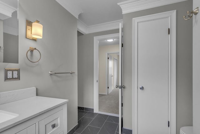 9315 Kingsley Dr, Onsted, MI 49265 - bathroom with marble finish floor, ornamental molding, toilet, vanity, and baseboards