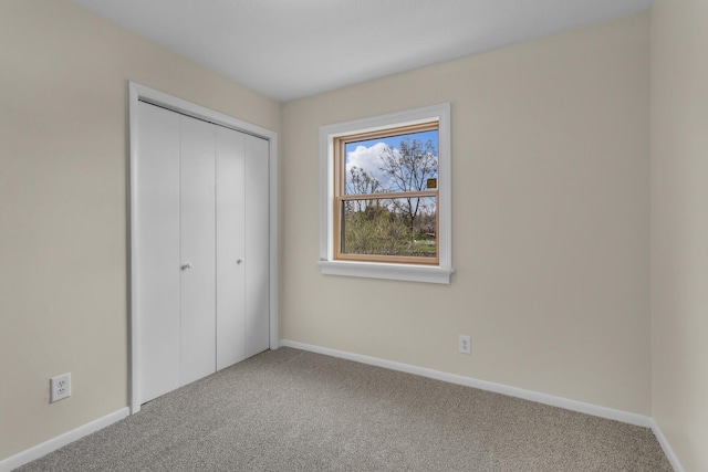 9315 Kingsley Dr, Onsted, MI 49265 - unfurnished bedroom with a closet, carpet floors, and baseboards