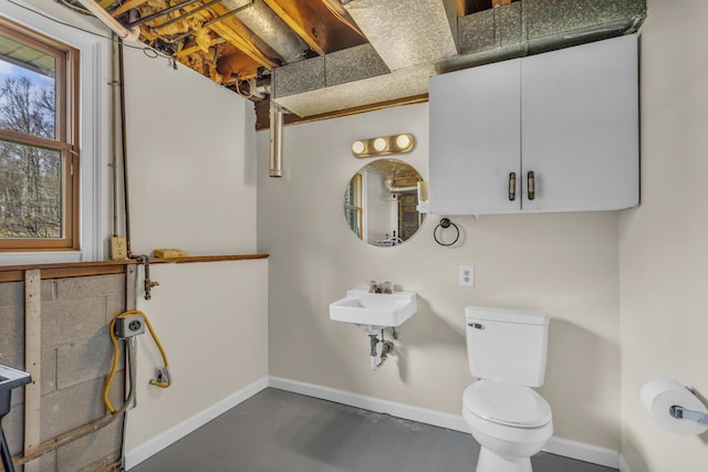 9315 Kingsley Dr, Onsted, MI 49265 - half bathroom with toilet, concrete floors, and baseboards