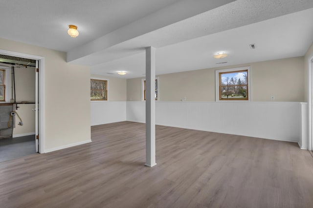 9315 Kingsley Dr, Onsted, MI 49265 - below grade area with visible vents and wood finished floors