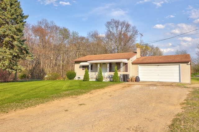 view of front of property featuring a front yard, dirt driveway, covered porch, a chimney, and an attached garage