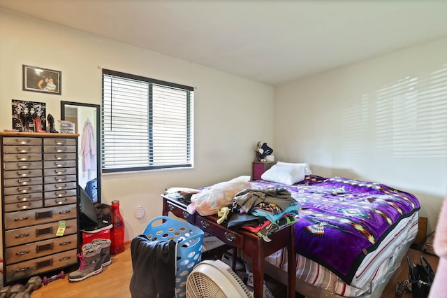 bedroom featuring wood finished floors