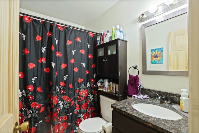 bathroom with vanity, toilet, and a shower with shower curtain