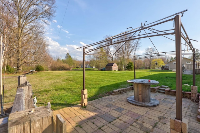 view of patio featuring an outbuilding and a storage unit