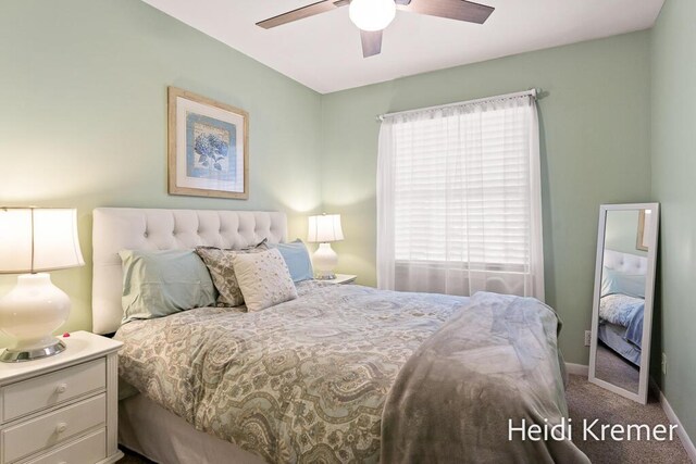 bedroom with ceiling fan, carpet, and baseboards