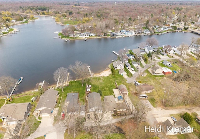 birds eye view of property with a residential view and a water view