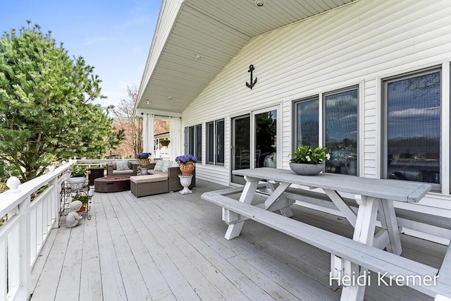 deck with outdoor dining space