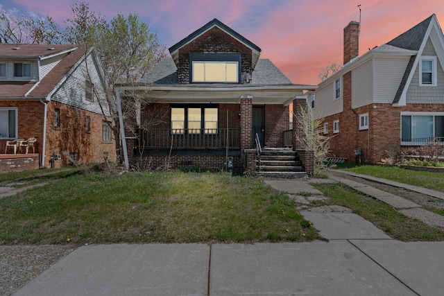 15374 Birwood St, Detroit, MI 48238 - bungalow featuring covered porch and brick siding