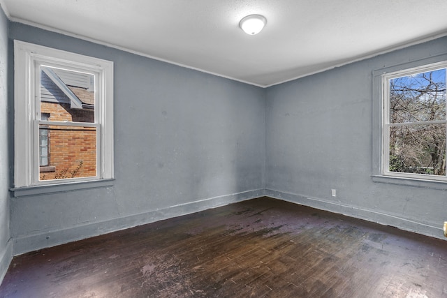15374 Birwood St, Detroit, MI 48238 - spare room with dark wood-style floors and baseboards