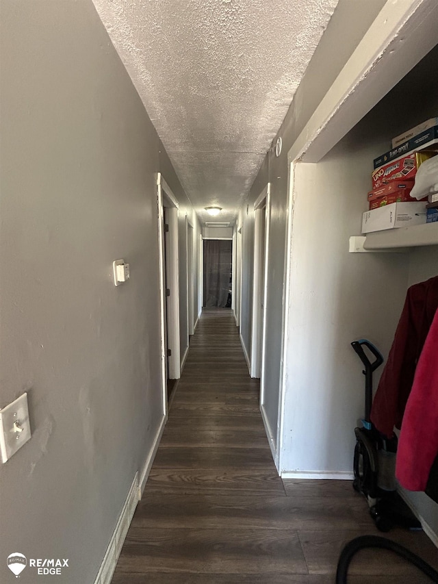 1934 Basil Ln, Flint, MI 48504 - corridor with a textured ceiling, wood finished floors, and baseboards