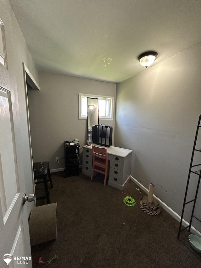1934 Basil Ln, Flint, MI 48504 - office area with dark colored carpet and baseboards