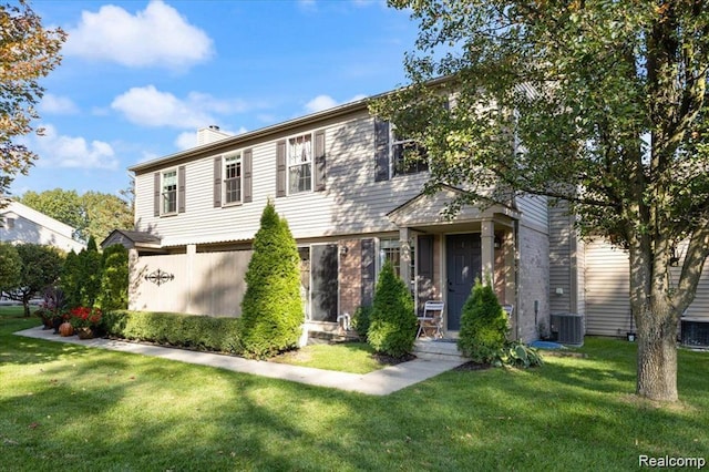 180 Pine Tree Ridge Dr Unit 3, Waterford, MI 48327 - view of front of house featuring a chimney, cooling unit, and a front lawn