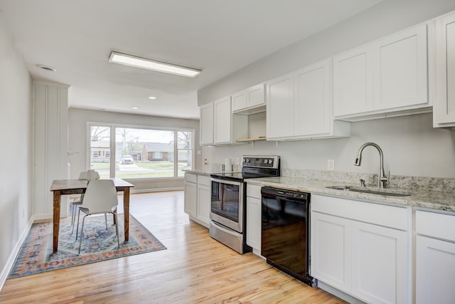 kitchen with white cabinets, a sink, light wood-style floors, dishwasher, and stainless steel electric stove