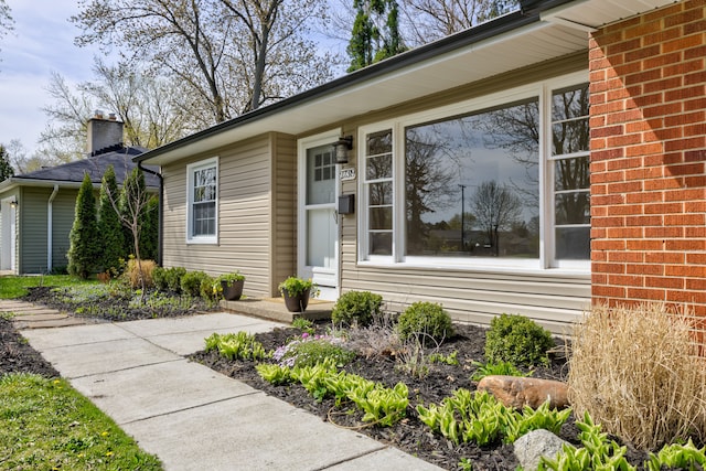 property entrance with a chimney