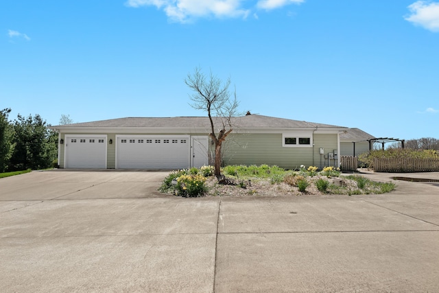 5480 Kensington Rd, Brighton, MI 48114 - view of home's exterior featuring driveway and fence