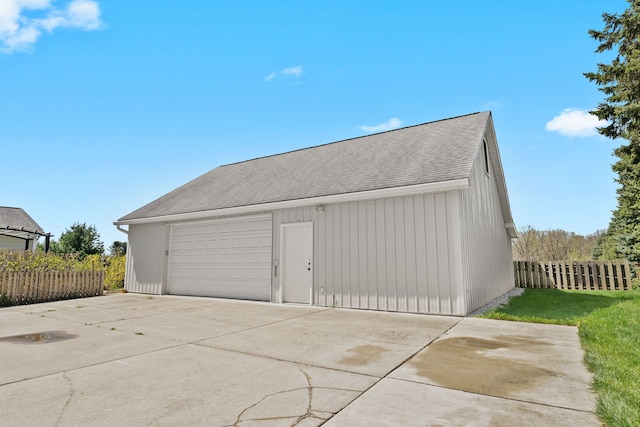 5480 Kensington Rd, Brighton, MI 48114 - detached garage featuring fence