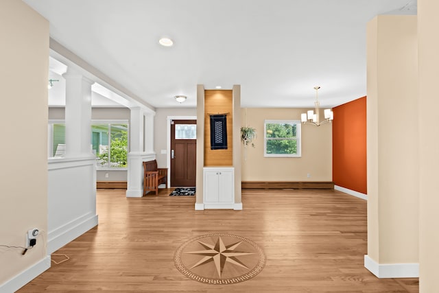 5480 Kensington Rd, Brighton, MI 48114 - unfurnished living room featuring light wood-style flooring, baseboards, a chandelier, recessed lighting, and a baseboard radiator